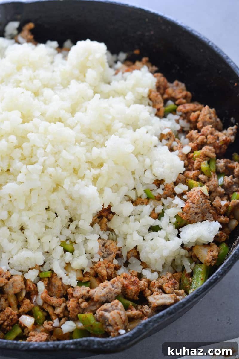 This low carb Keto Taco Casserole is loaded with seasoned ground beef, vegetables and loads of cheese!