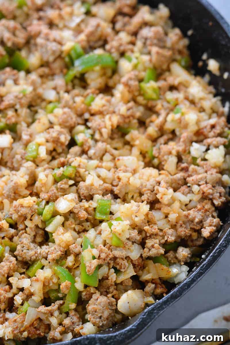 This low carb Keto Taco Casserole is loaded with seasoned ground beef, vegetables and loads of cheese!