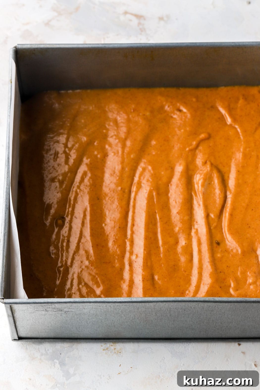Pumpkin Pecan Upside-Down Cake Recipe 10 spread on top of the pecan mixtures
