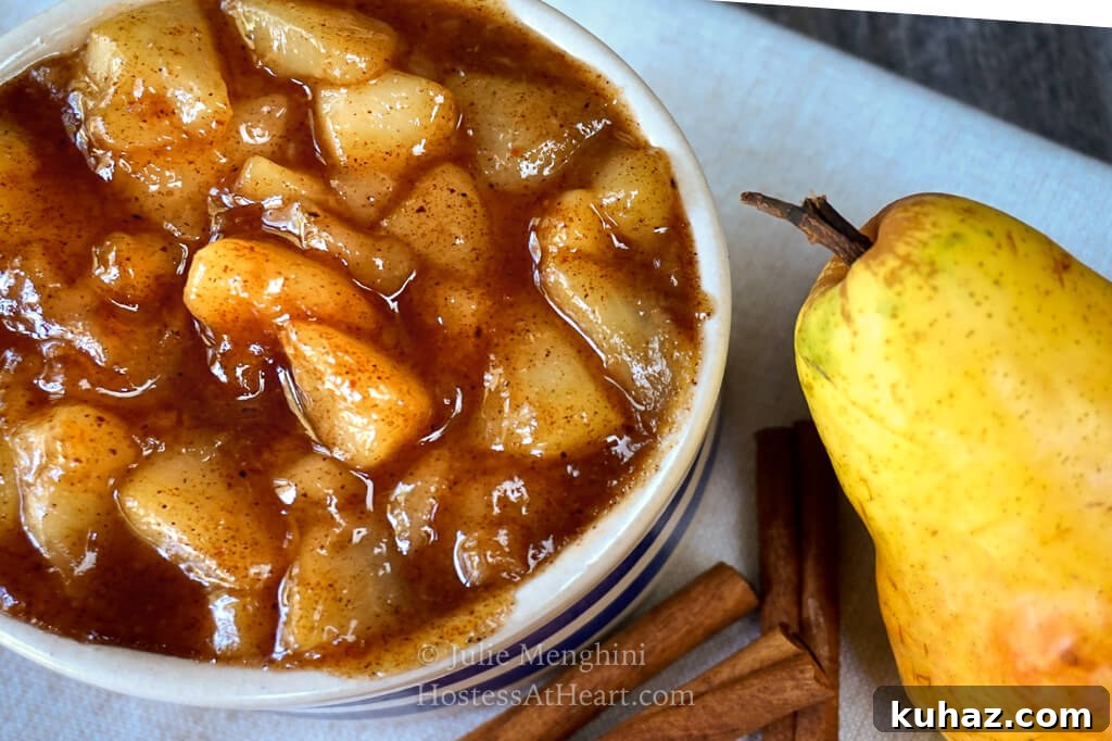 90 degree angle of bowl of pear pie filling with pear