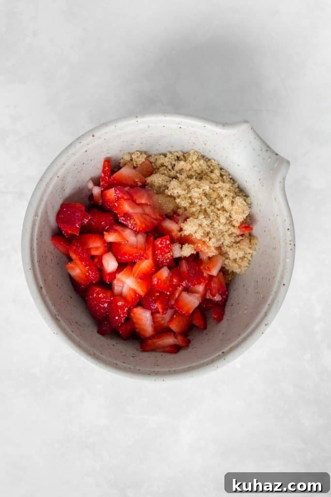 Flaky Homemade Strawberry Danish with Cream Cheese Recipe 6 Strawberry, brown sugar, and lemon juice in a bowl.