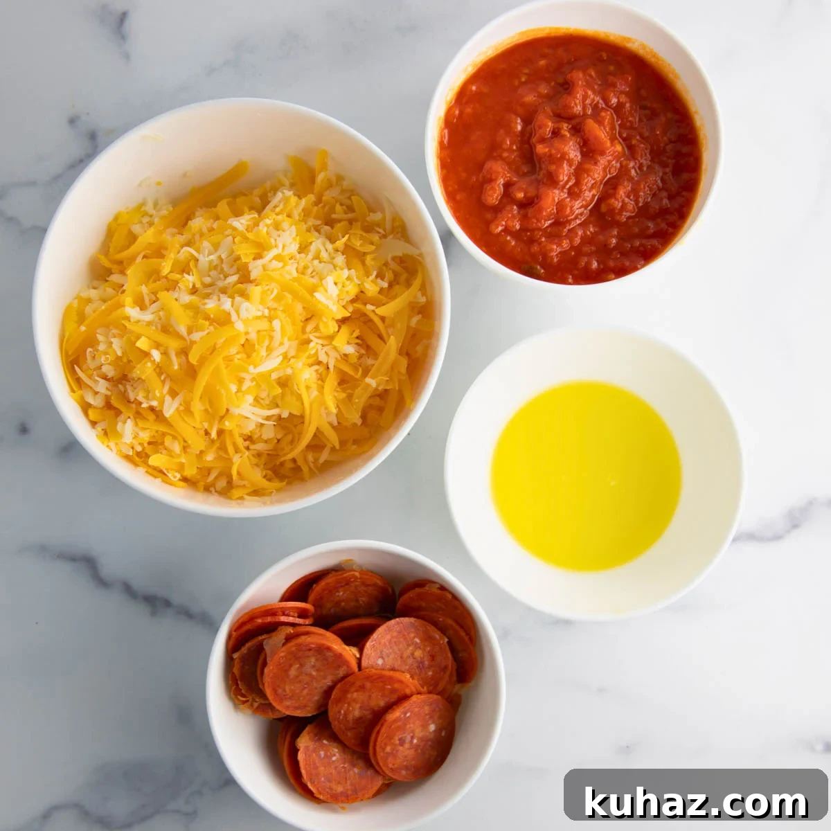 Pizza-Style Potato Skins Recipe with Pepperoni & Mozzarella 5 ingredients for pizza potato skins on the counter