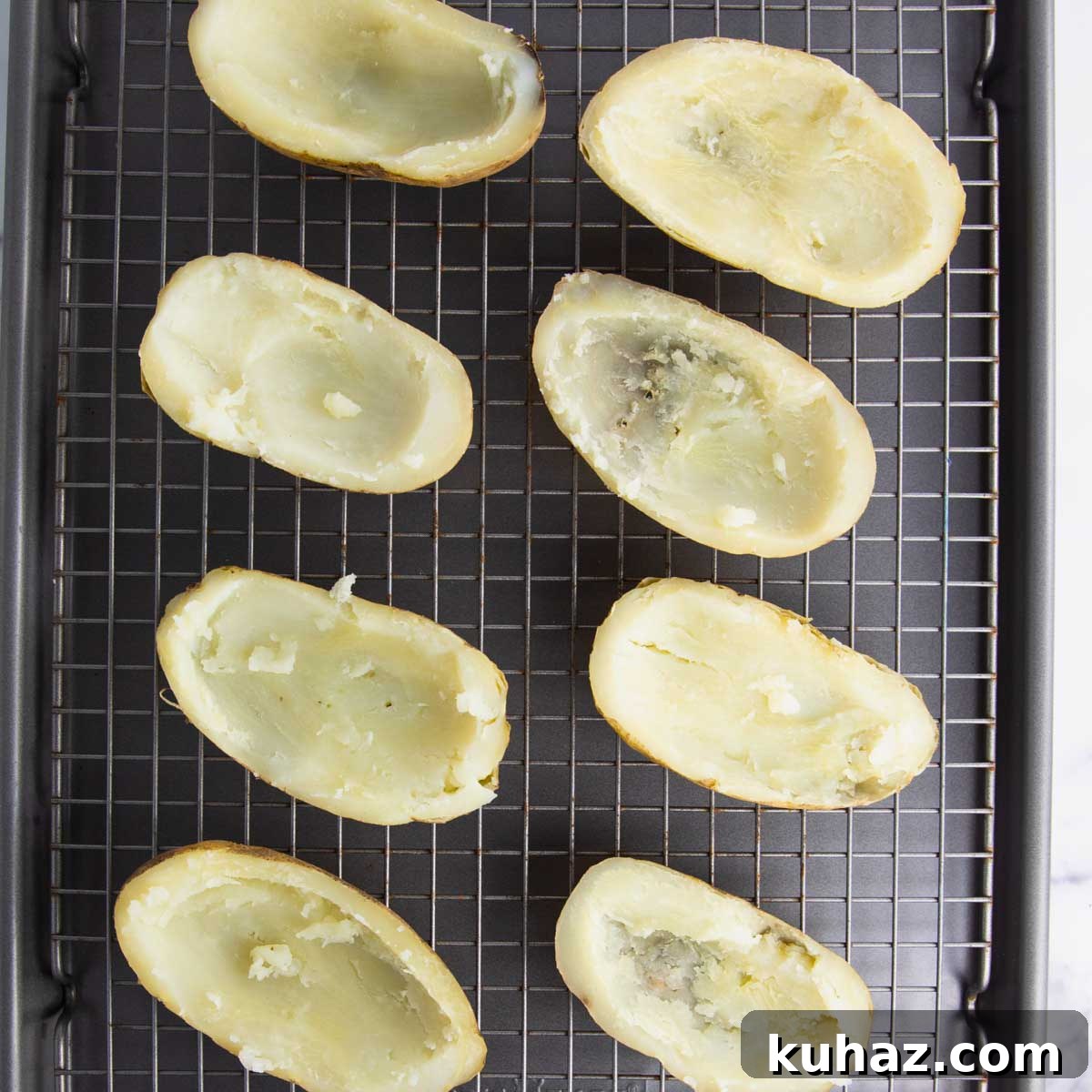 Pizza-Style Potato Skins Recipe with Pepperoni & Mozzarella 7 potato skins prepared for the broiler with butter and salt and pepper
