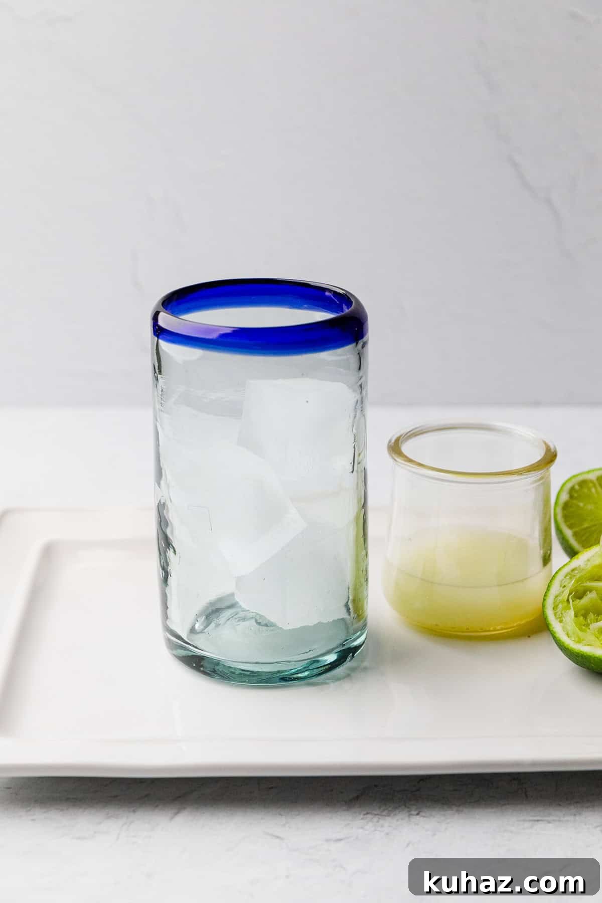 Add ice to high ball glass.
