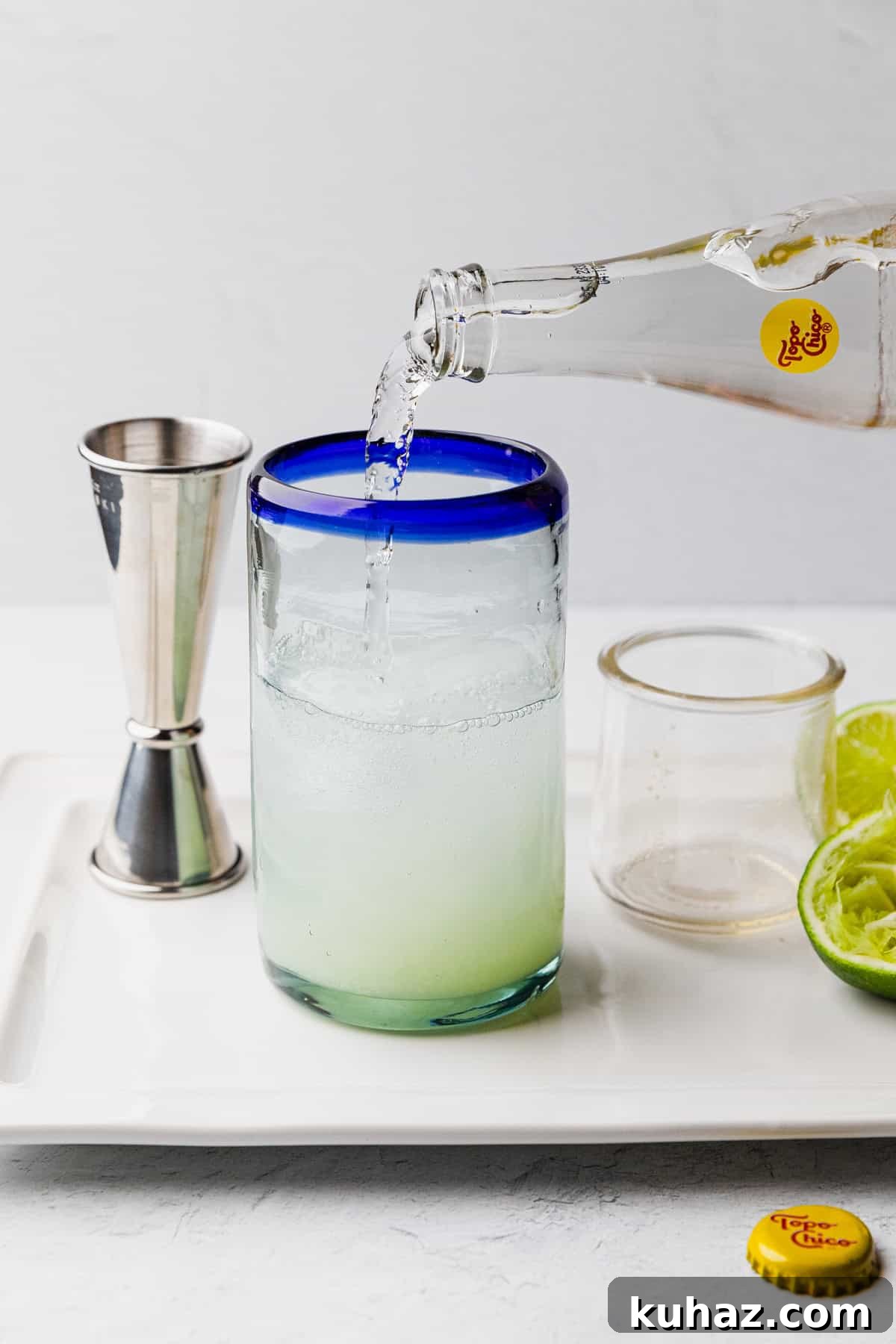 Pour topo chico into glass.