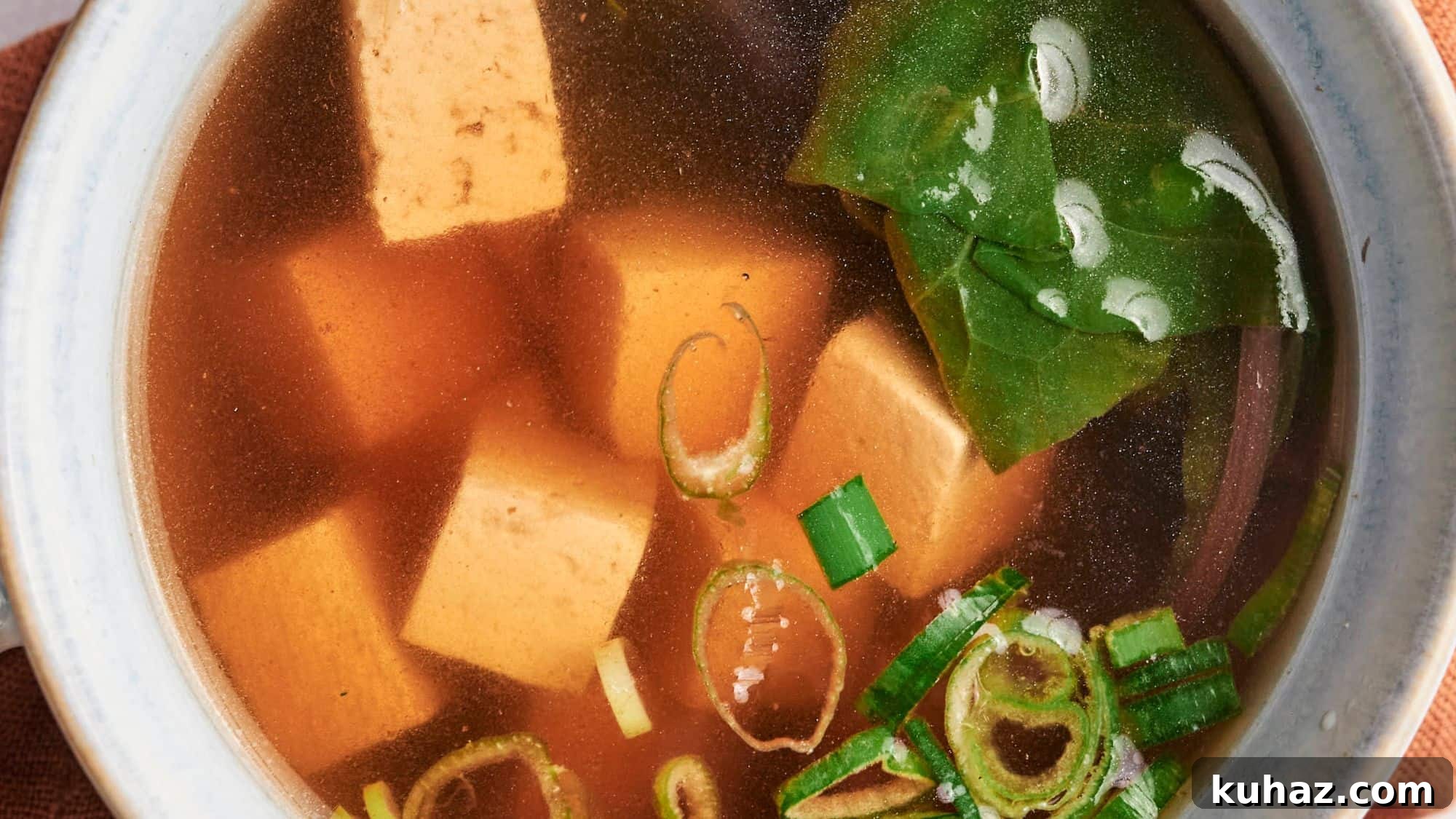 19 Asian Recipes That Fed My Family for $20 11 A bowl of miso soup with tofu cubes, seaweed, and green onions.