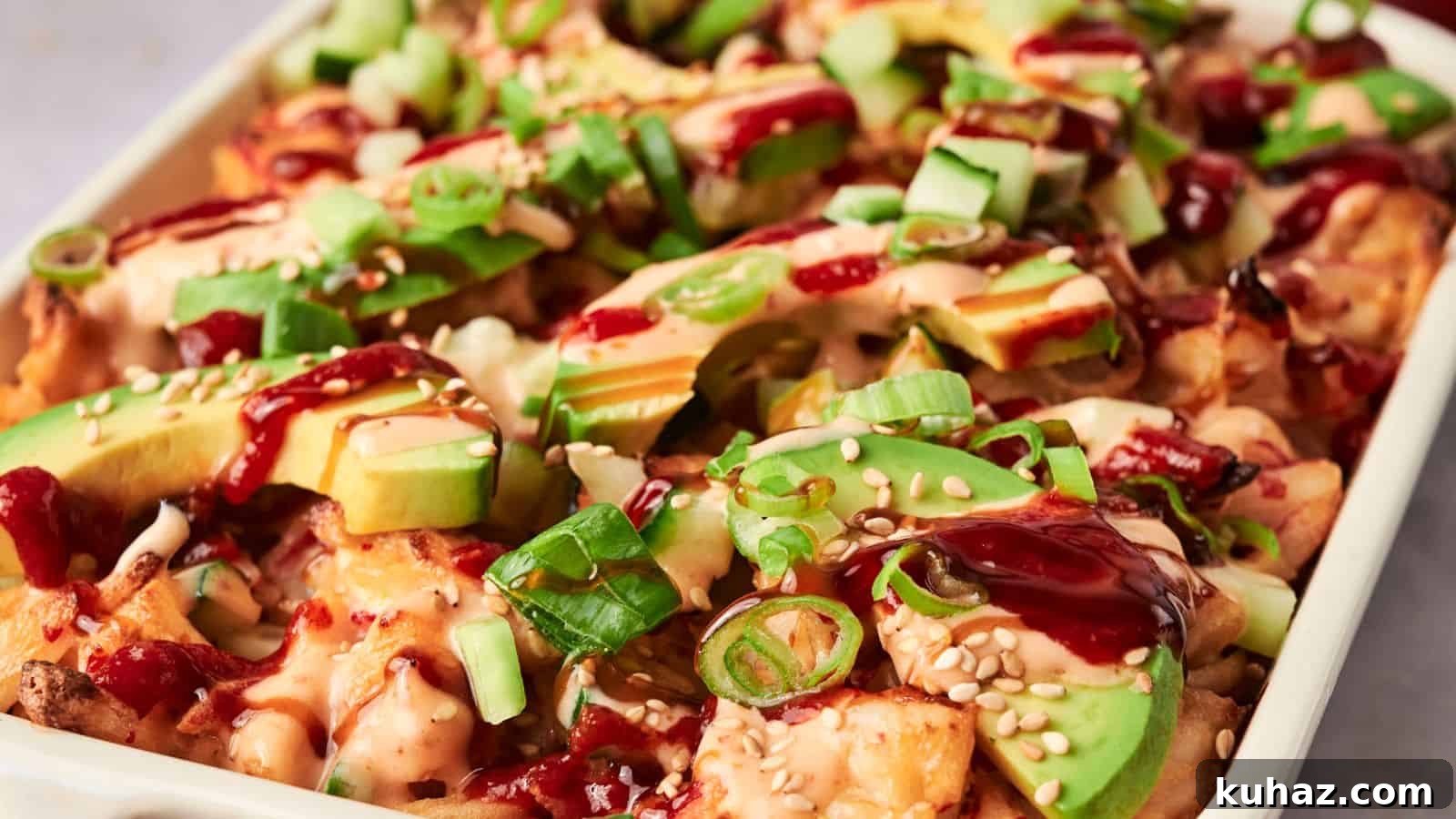 19 Asian Recipes That Fed My Family for $20 17 A dish of loaded fries inspired by sushi bake, topped with avocado slices, diced cucumbers, green onions, sesame seeds, and drizzled with sauce.