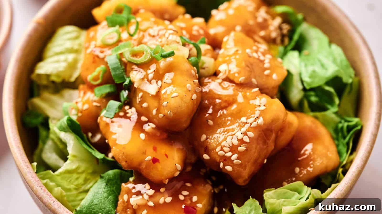 19 Asian Recipes That Fed My Family for $20 8 A bowl of crispy tofu coated in sesame sauce, garnished with green onions and sesame seeds, served on a bed of lettuce.