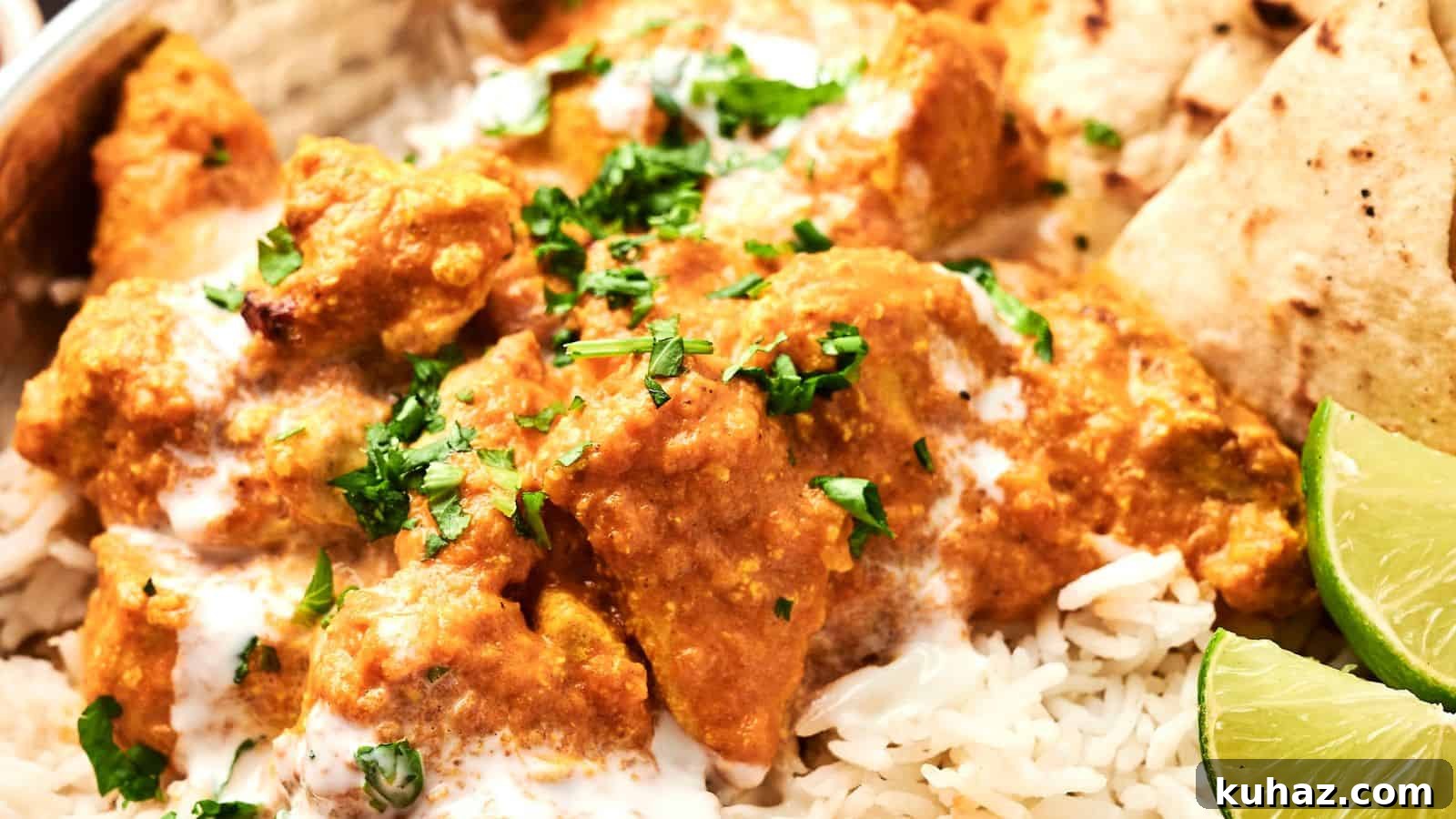 19 Asian Recipes That Fed My Family for $20 10 A close-up of chicken tikka masala served on rice, garnished with fresh cilantro, with lime wedges and naan on the side.