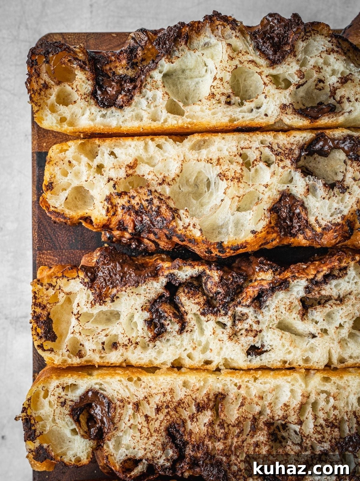 Chocolate Focaccia Recipe with Same Day Dough and Video 8 Chocolate Focaccia slices on a wooden cutting board.