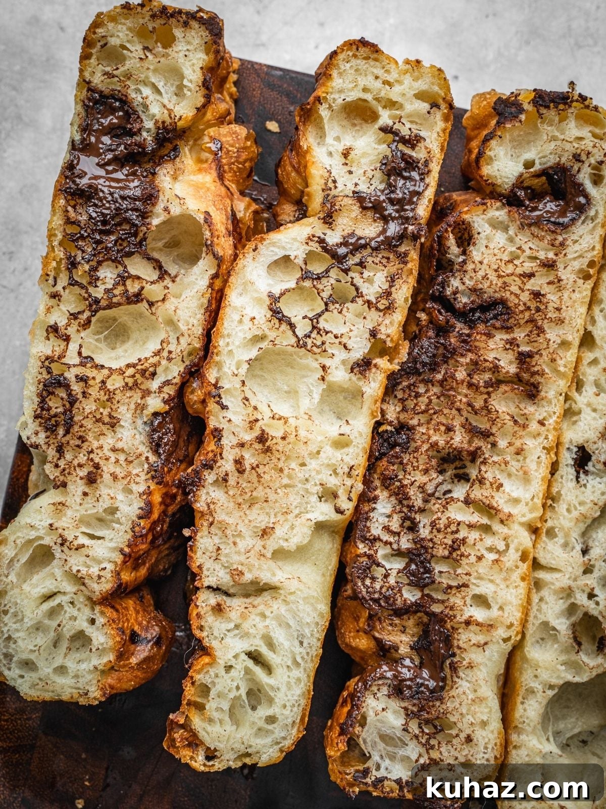 Chocolate Focaccia Recipe with Same Day Dough and Video 9 Chocolate Focaccia slices on a wooden cutting board.