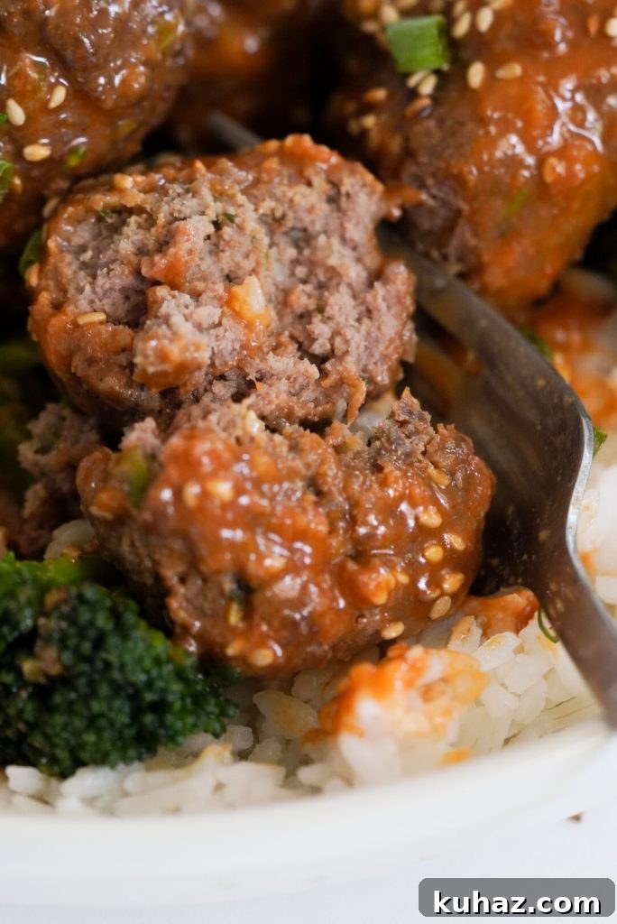 Spicy Firecracker Meatballs Recipe with Sweet Chili Glaze 13 closeup shot of a spicy firecracker meatball that has been cut in half.