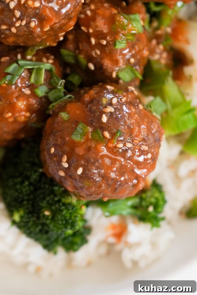 Spicy Firecracker Meatballs Recipe with Sweet Chili Glaze 15 overhead shot of a bowl of firecracker meatballs with rice and veggies.