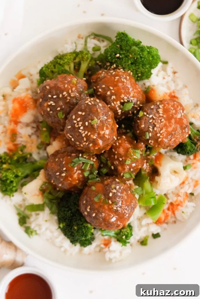 Spicy Firecracker Meatballs Recipe with Sweet Chili Glaze 16 overhead shot of a bright and colorful bowl of firecracker beef meatballs with broccoli and rice.