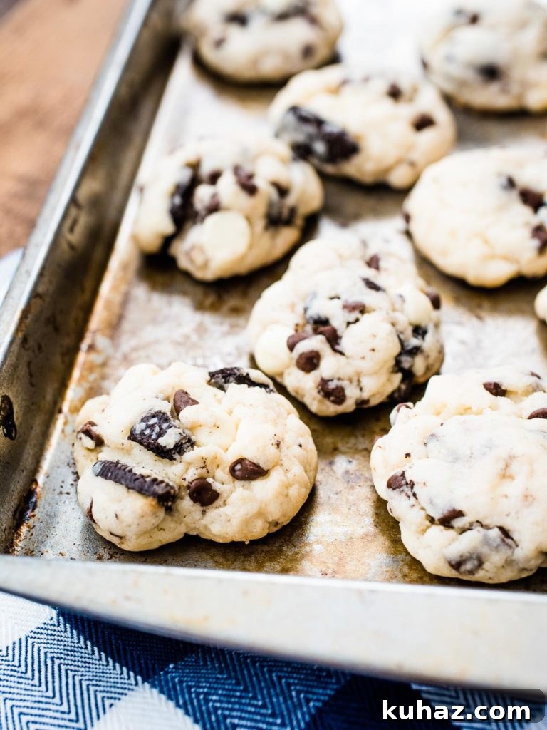Soft Oreo Cheesecake Cookies Recipe 2 cookies on a baking sheet