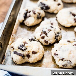 Soft Oreo Cheesecake Cookies Recipe 3 cookies on a baking sheet