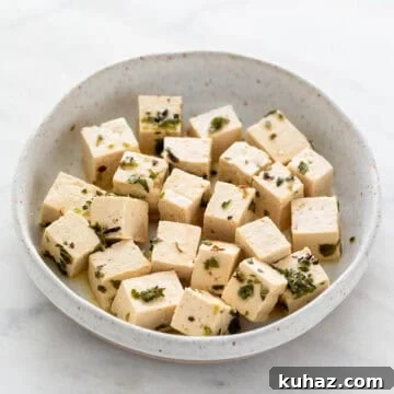 Dish holding vegan feta cheese.