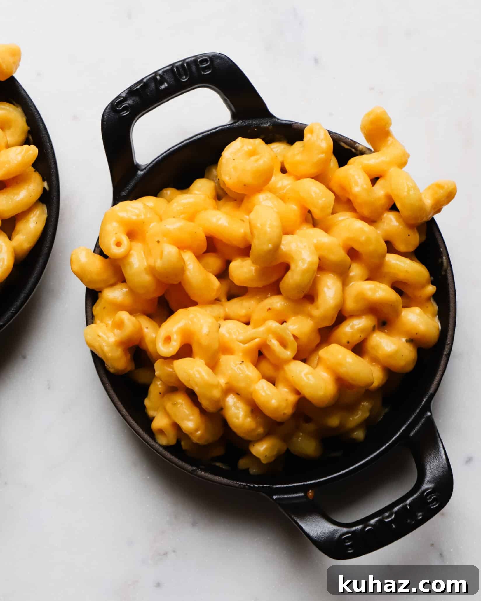 14 Crowd-Pleasing Game Day Appetizers 13 Creamy buffalo macaroni and cheese in a black cast iron dish.