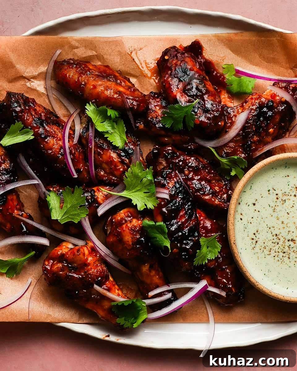 14 Crowd-Pleasing Game Day Appetizers 5 Grilled chicken wings with Sambal BBQ sauce, red onions, cilantro, and dipping sauce.