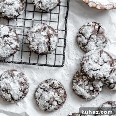 completed Vegan Chocolate Crinkle Cookies on a white surface
