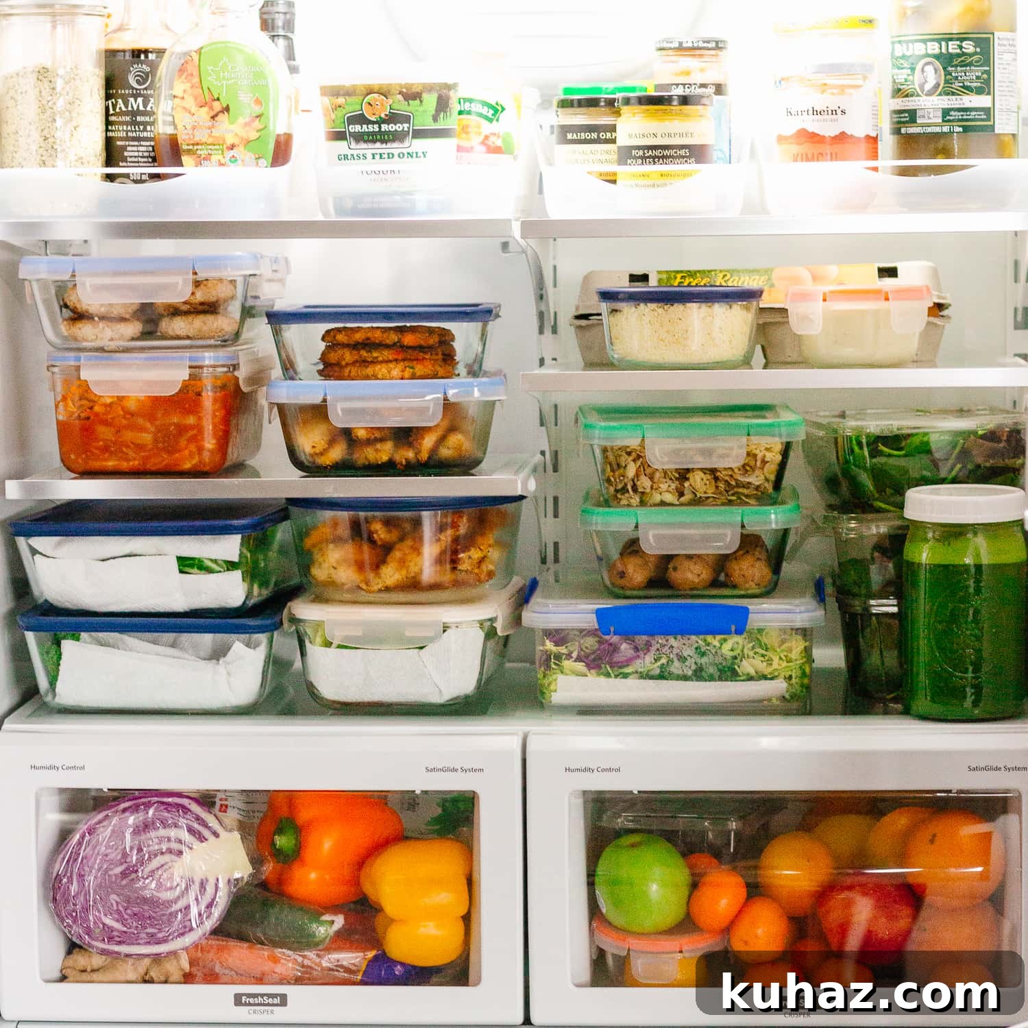 Meal Prep Recipes Inspired by The HealthNut Cookbook 5 Inside of a fridge filled with containers of meal prep recipes made from The HealthNut Cookbook