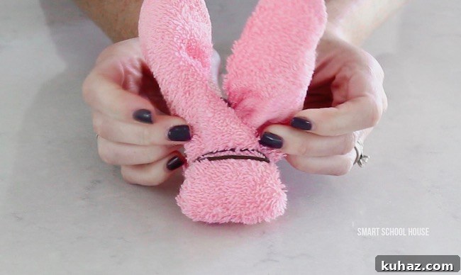 Make an Adorable Washcloth Bunny: Step-by-Step Folding Tutorial 8 How to make wash cloth bunnies. Also called boo boo bunnies. Good baby shower idea too!
