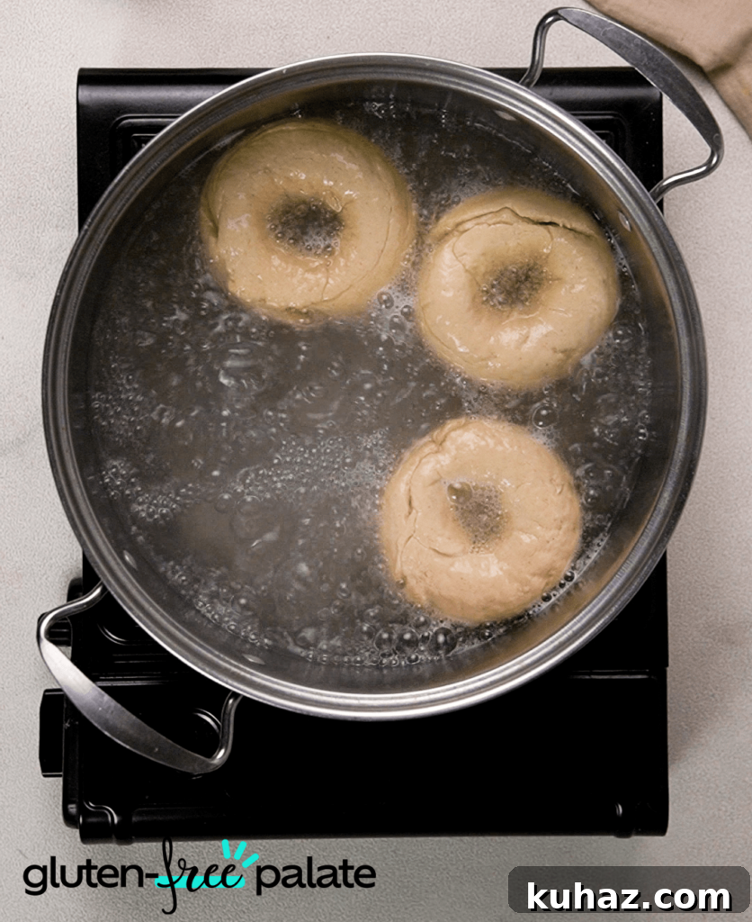 Soft and Chewy Gluten-Free Bagels Recipe 9 Drop the shaped bagels into boiling water.