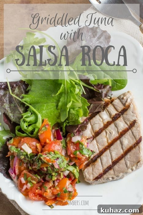White plate with griddled tuna and salad