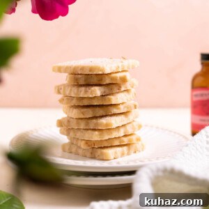 Rose Shortbread Cookies with Delicate Floral Flavor 3 A stack of rose shortbread cookies on a plate