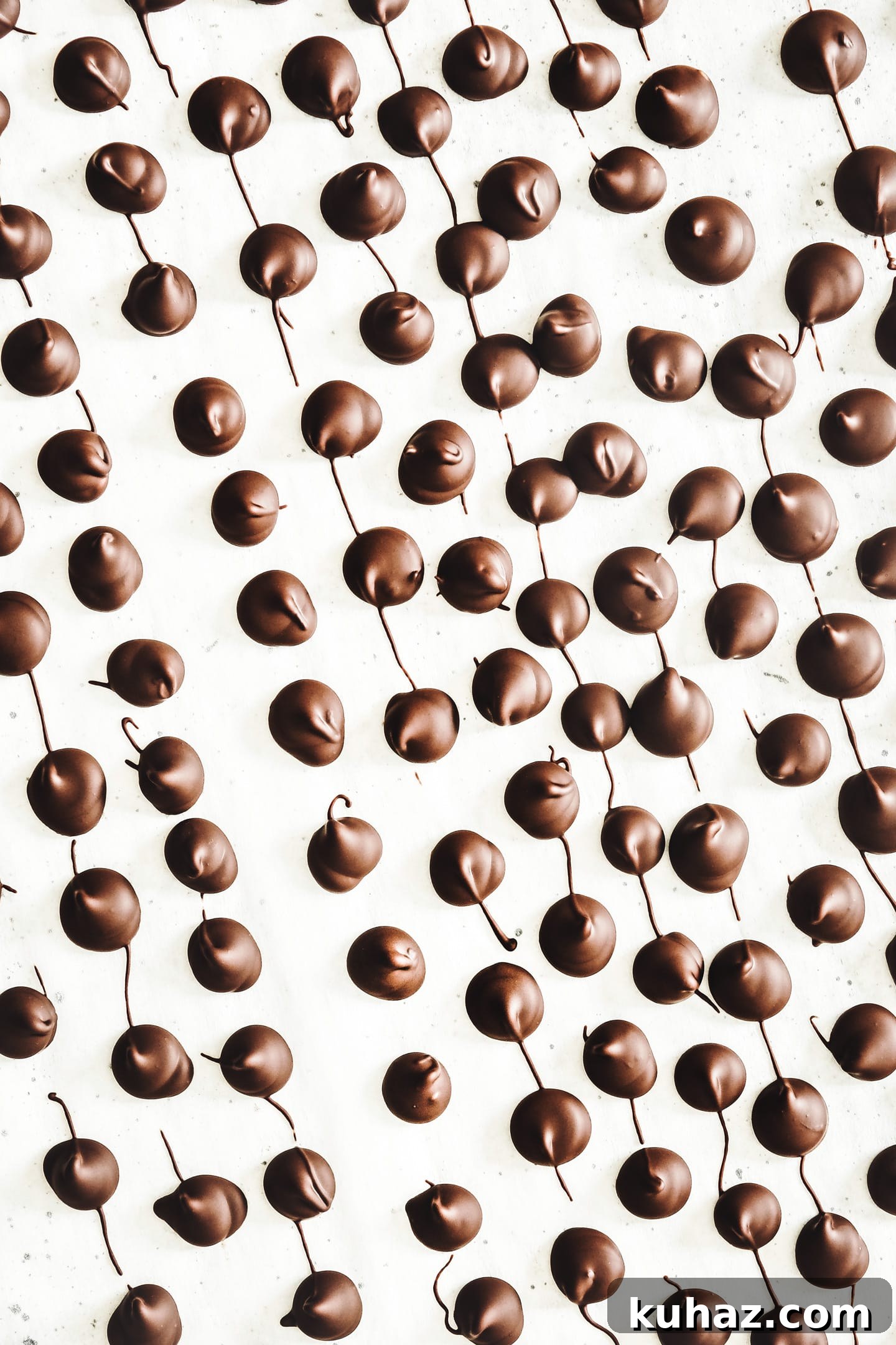 hardened homemade chocolate chips on parchment