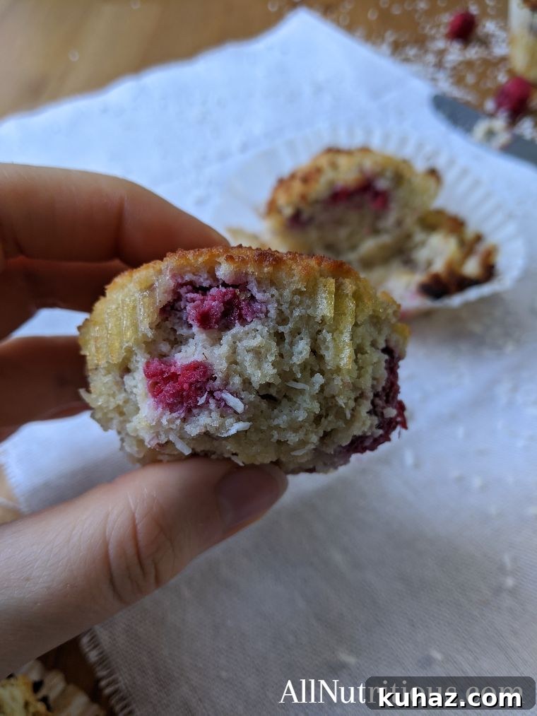 Keto Raspberry Coconut Cupcakes - 4.3g Net Carbs 3 low carb cupcakes with raspberries