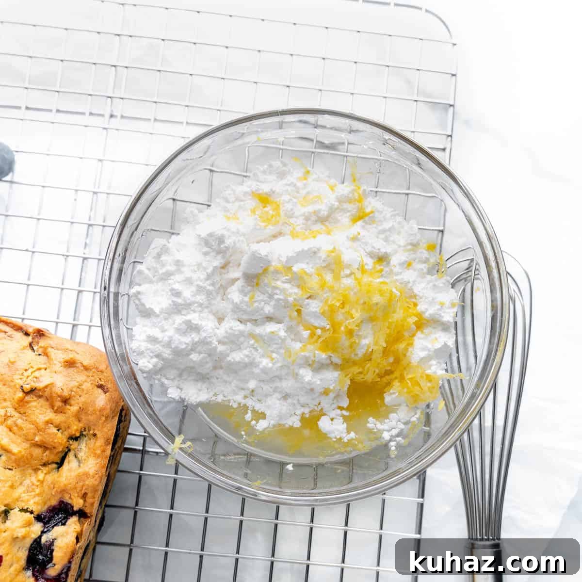 a bowl of powdered sugar and lemon zest.