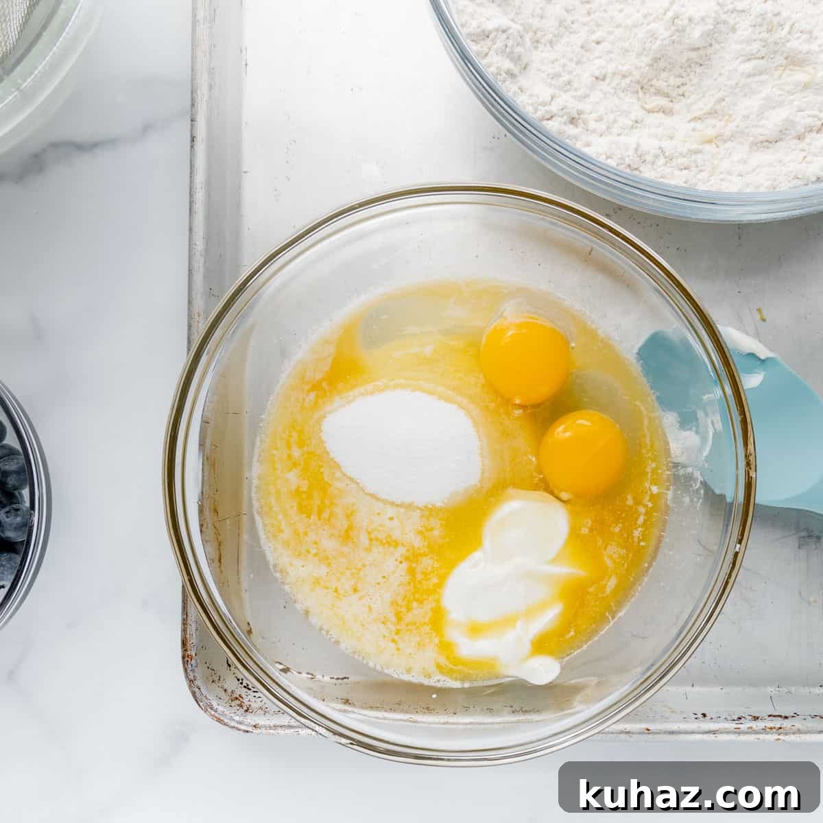 The wet ingredients in a clear bowl.