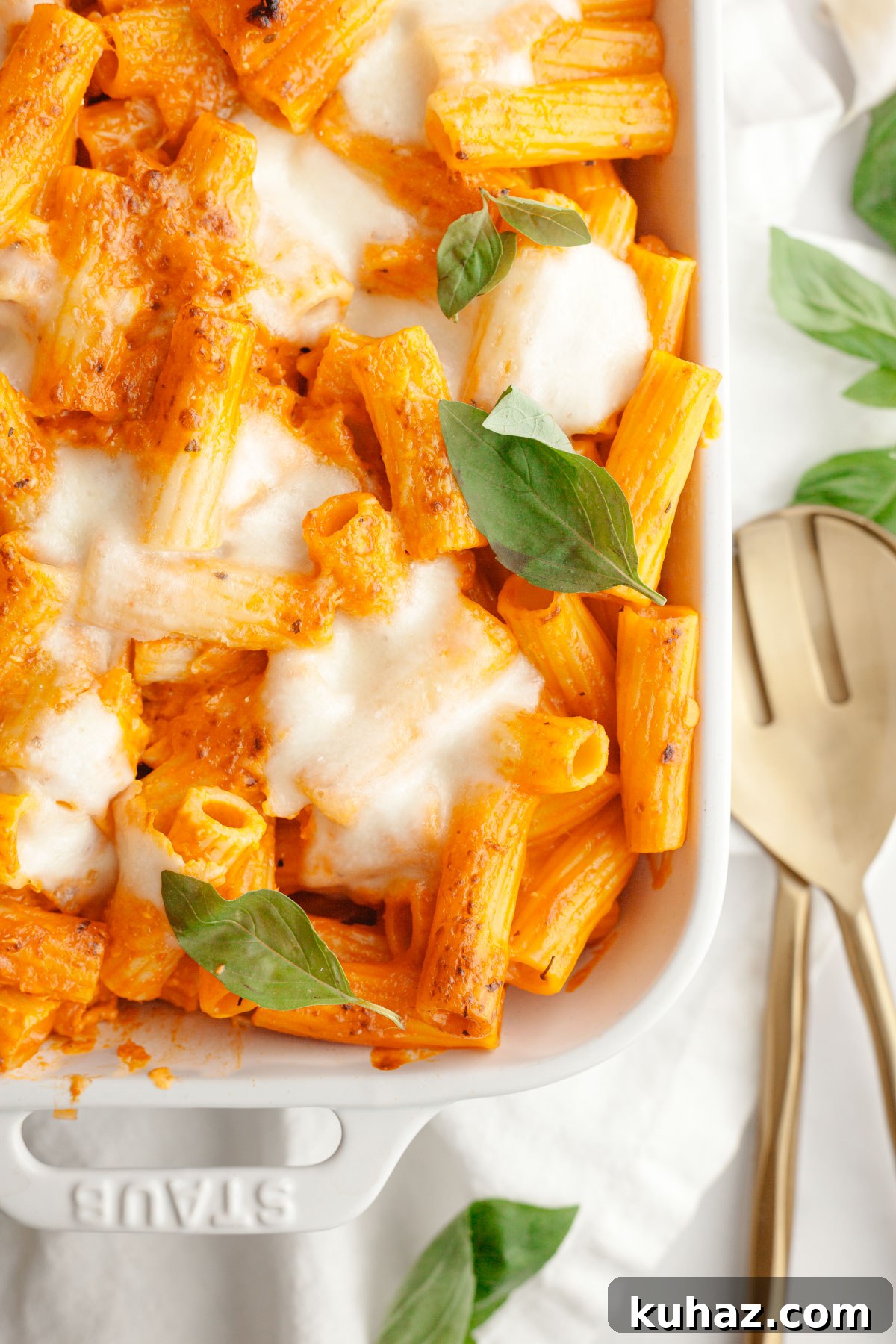 Creamy Baked Pasta with Vodka-Style Sauce, Alcohol-Free 11 Baked vodka pasta in a white dish topped with basil leaves.