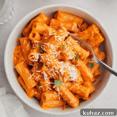 Spicy vodka pasta in a small white bowl.
