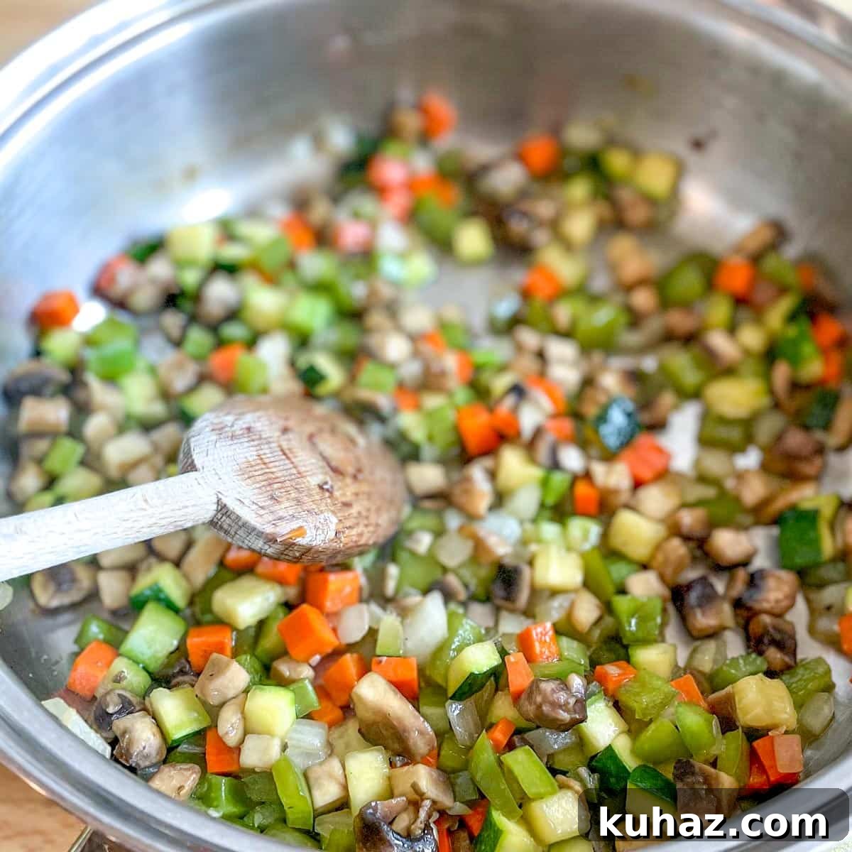 Linguine with Classic Bolognese Sauce 4 The diced vegetables are sweated in a stainless steel pan.