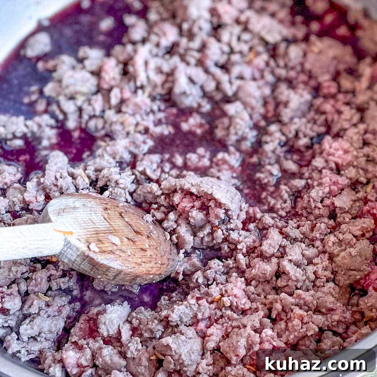 Linguine with Classic Bolognese Sauce 7 Red wine is added to the ground beef in the pan.
