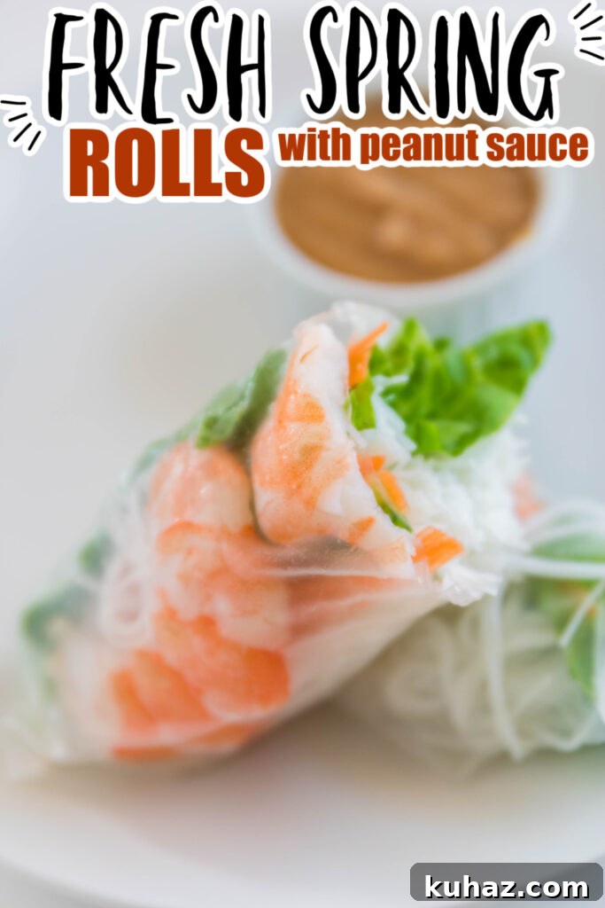 Vietnamese Shrimp Spring Rolls Recipe 6 shrimp spring roll with shrimp on a white plate cut in half