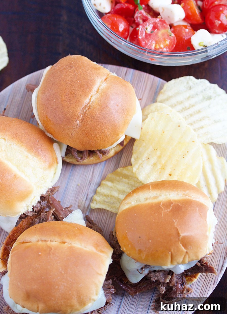 Slow Cooker Flank Steak Sliders Recipe 4 Tray of toasted slider buns with melted cheese