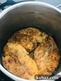 seared chicken cutlets in instant pot ready to be pressure cooked
