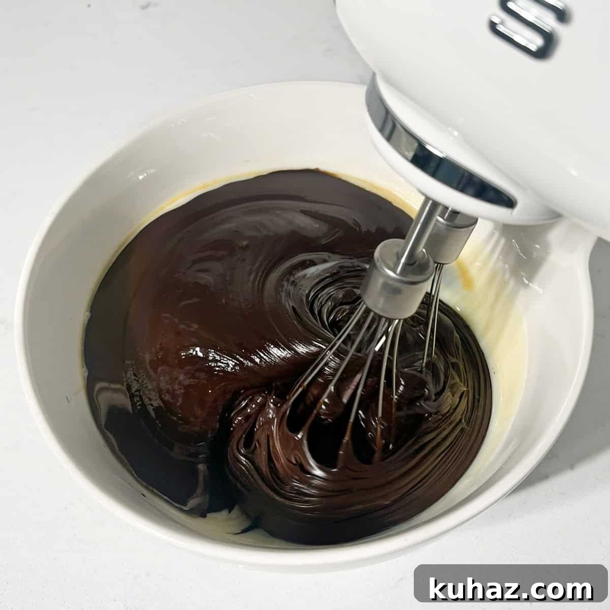 No-Churn Dark Chocolate Ice Cream Recipe 7 Whisking the melted chocolate and condensed milk together.