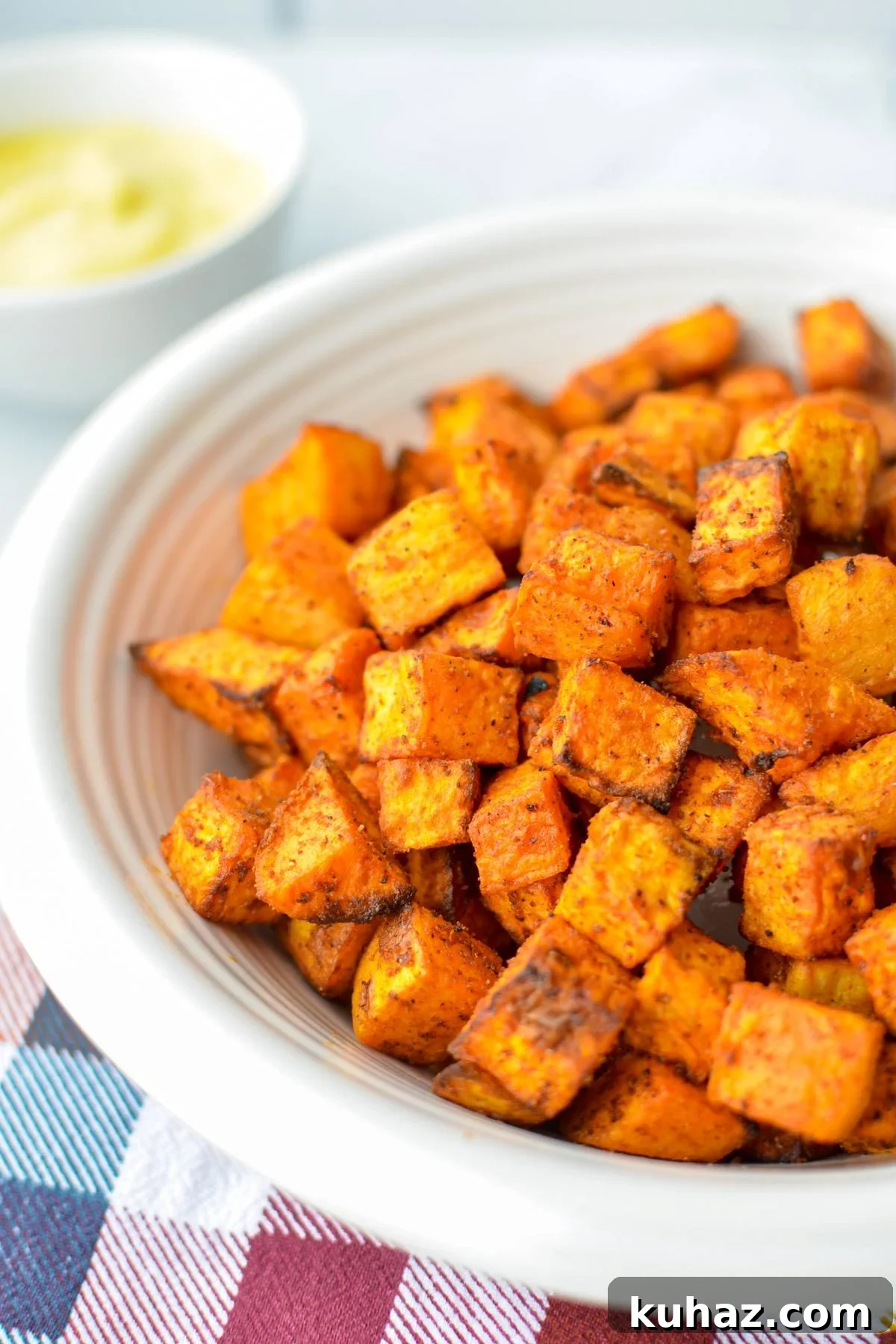 Crispy Air Fryer Sweet Potato Cubes 2 A bowl of air fried sweet potato cubes.