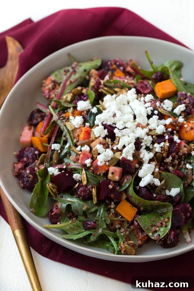 Roasted Sweet Potato, Beet, Apple and Quinoa Salad is made with fresh greens, vegetables, spiced pepitas, dried cranberries, goat cheese and a simple balsamic honey dressing!
