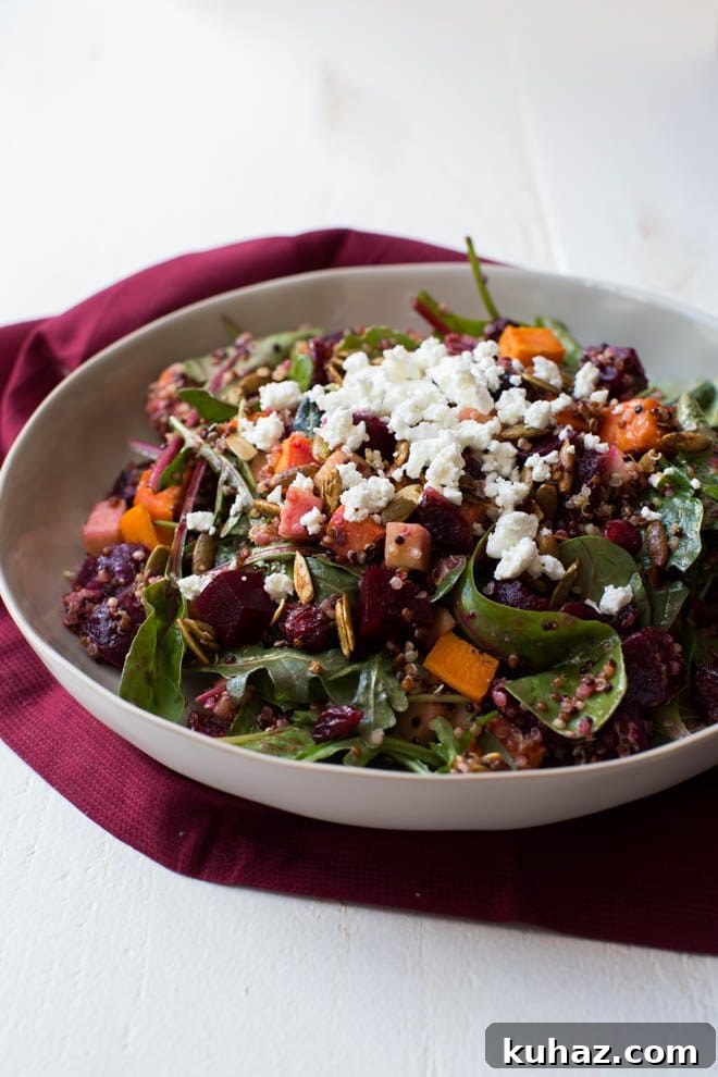 Roasted Sweet Potato, Beet, Apple and Quinoa Salad is made with fresh greens, vegetables, spiced pepitas, dried cranberries, goat cheese and a simple balsamic honey dressing!