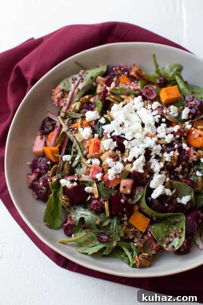 Roasted Sweet Potato, Beet, Apple and Quinoa Salad is made with fresh greens, vegetables, spiced pepitas, dried cranberries, goat cheese and a simple balsamic honey dressing!
