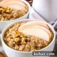 The finished steel cut oats topped with sliced apples.