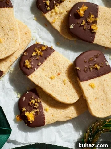 Sourdough Discard Shortbread Cookies on white parchment paper.