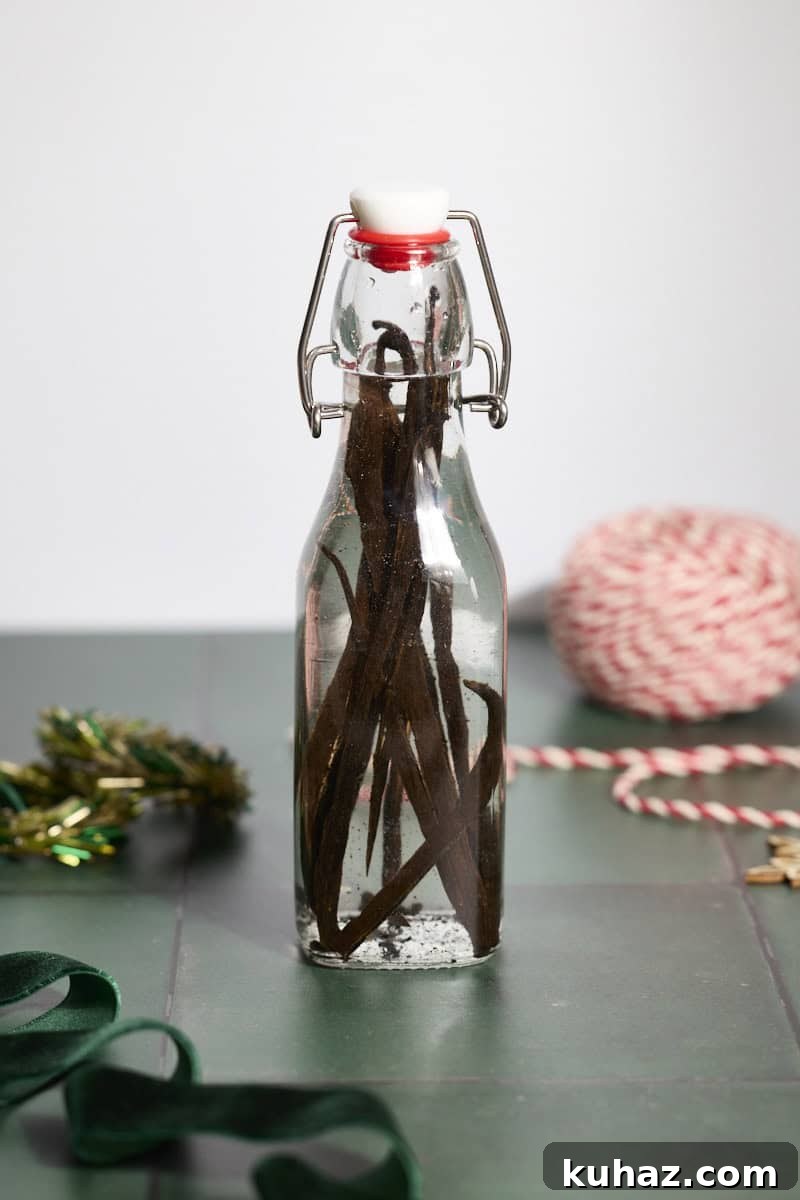 Vodka poured into the bottle with the vanilla beans.