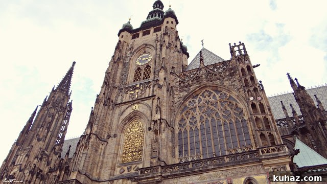 A large stone building with a clock tower