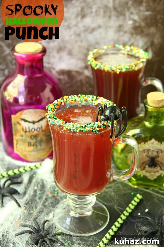 Spooky Halloween punch with dark streaks from a decorated candy rim.